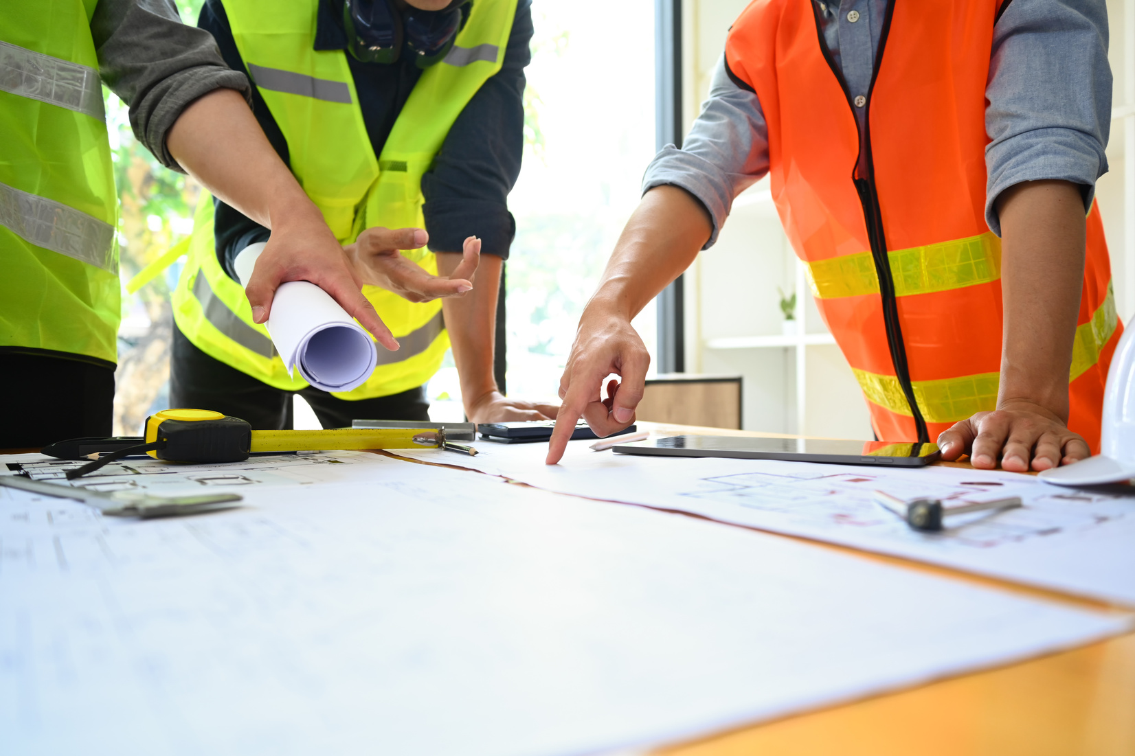 Construction engineers team supervising progress of construction